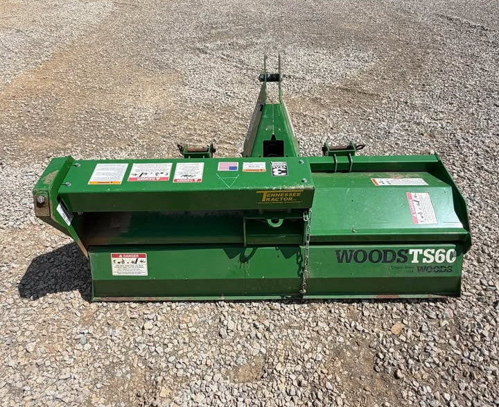 A green WoodSt TS60 tiller attachment for a tractor, 